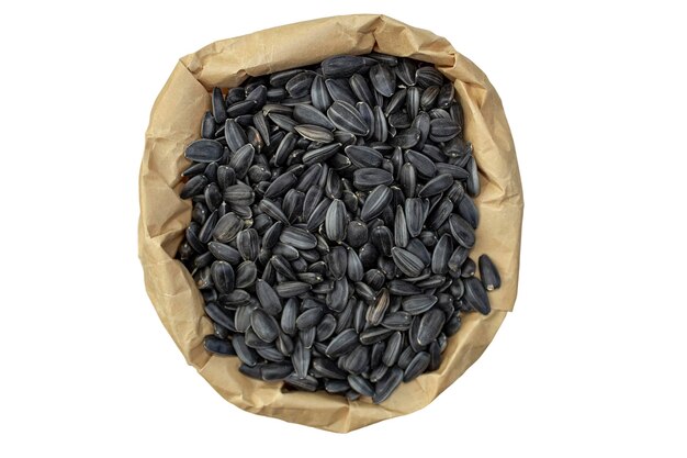 Black seeds in a paper bag isolated on a white background