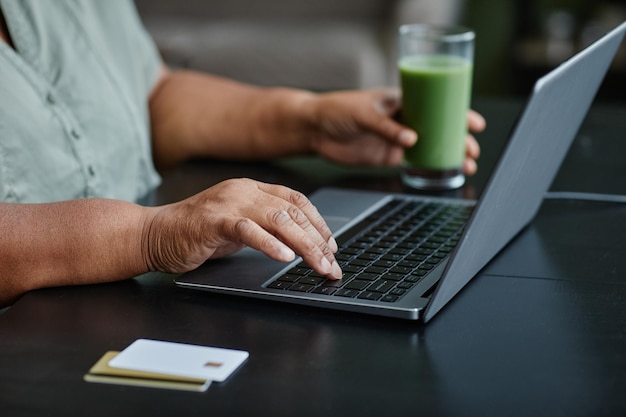 Black Senior Woman Using Laptop Close Up