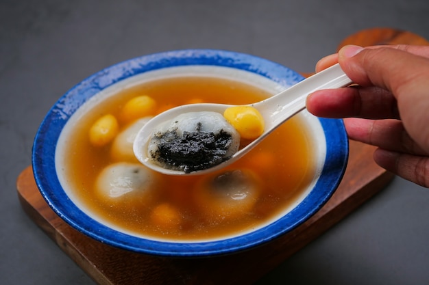 Black sesame dumplings in ginger tea