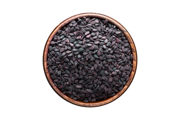 Black sesame seeds spice in wooden bowl