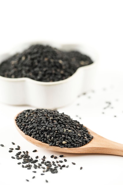 Black Sesame Seeds in Wooden Spoon Pile and Spread