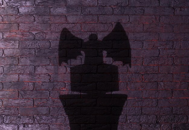 black shadow of an angel on a black background