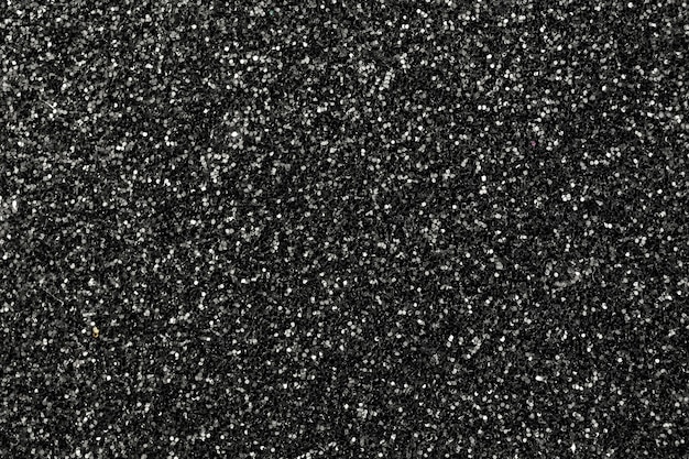 Foto concetto di effetti luminosi neri brillanti, sfondo texture glitter, foto di superficie alta dettagliata sandpapper