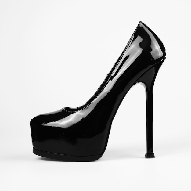 Photo black shiny stiletto heel women's pump shoe on white