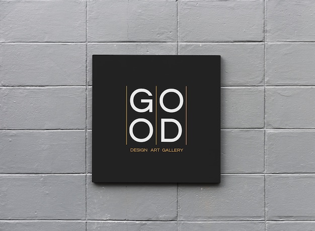 Black sign on a white wall mockup