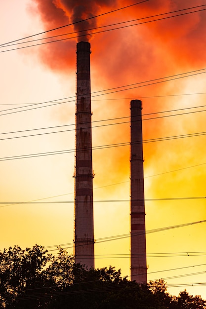 Black silhouette of big industry tubes. Factory industrial gas technology.