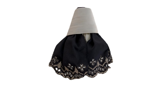 A black and silver lamp shade with a silver flower pattern.