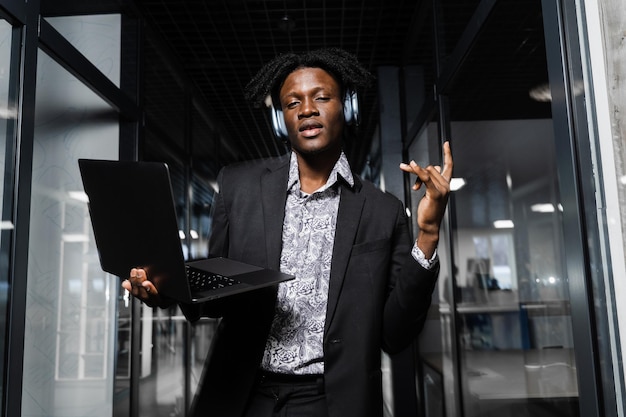 Black skin dj in headphones is listening music, making dj set and dancing. Party lifestyle.