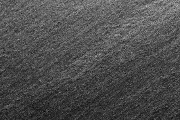 Photo black slate background or textured stony table close-up. hi res photo.