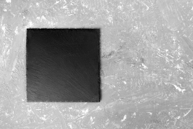Black slate plate for serving with copy space, top view