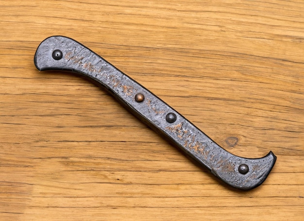 Black smith tool on wooden background