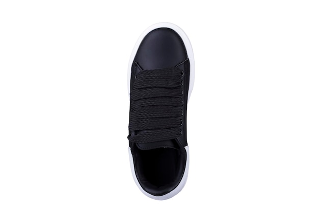 Black sneaker top view with wide laces