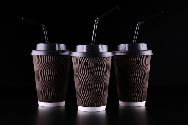 Black space takeaway three coffee cups. Coffee to go. Mockup