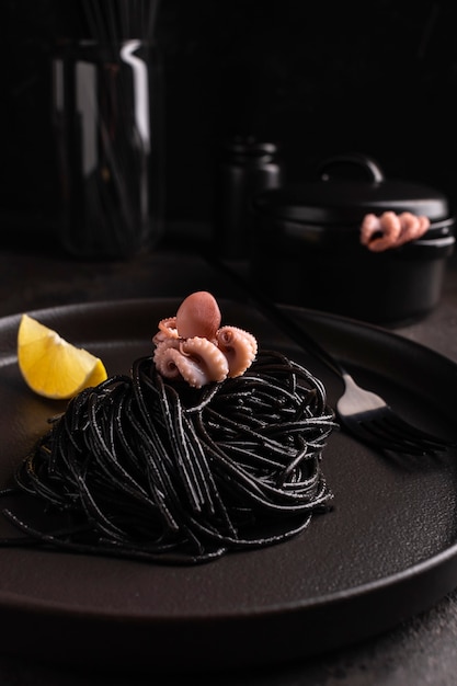 Black spaghetti with cuttlefish ink with boiled octopus