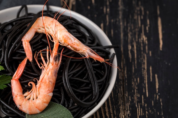 Black spaghetti with prawns. Homemade.