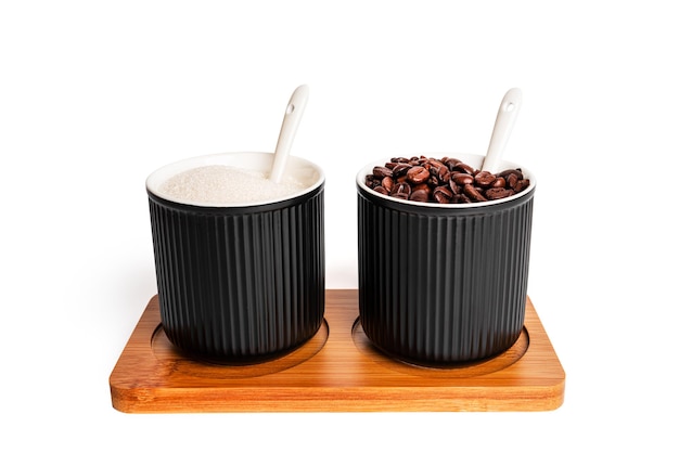 Black spice jars with sugar and coffee beans isolated on a white background. Sugar bowl. High quality photo