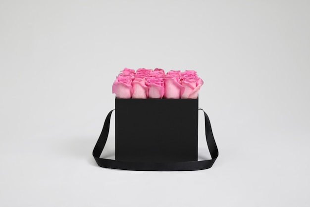 Black square gift flower box with pink roses inside