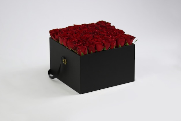 Black square gift flower box with red roses inside