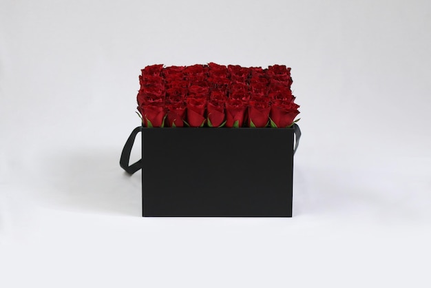 Photo black square gift flower box with red roses inside