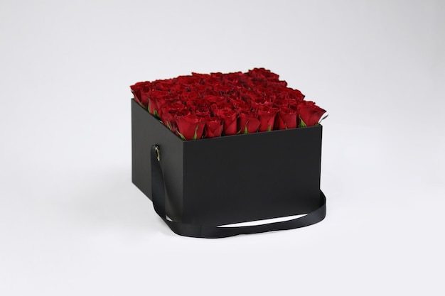 Black square gift flower box with red roses inside