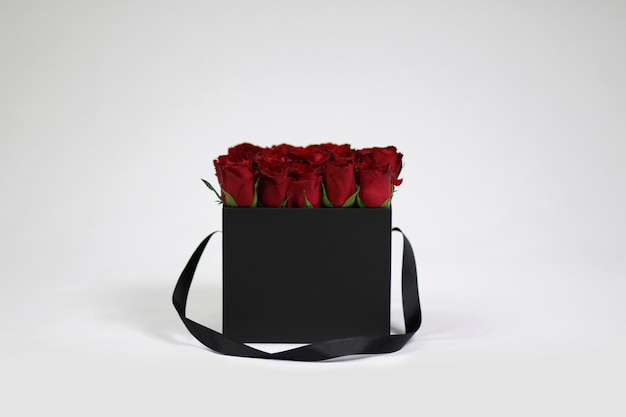 Black square gift flower box with red roses inside