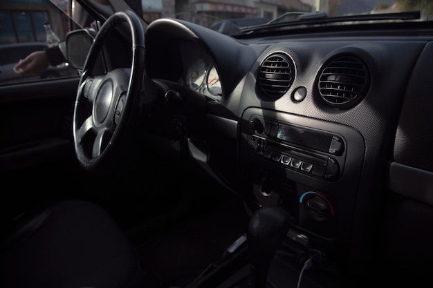 Black steering wheel in luxury car