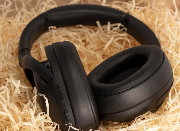 Black stereo headphones in gift tinsel paper shavings