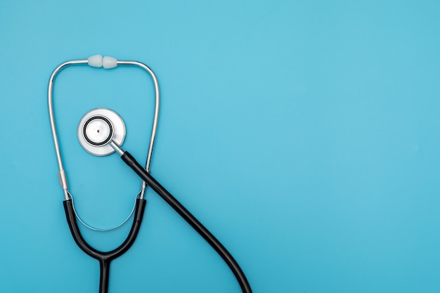 Black Stethoscope on blue background