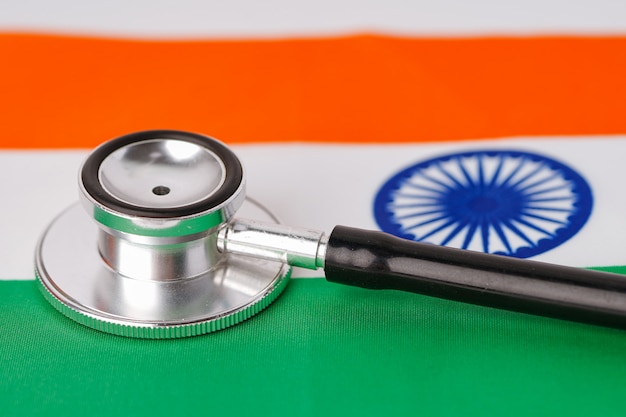 Black stethoscope on India flag background.