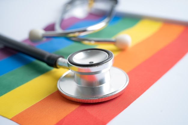 Black stethoscope on rainbow flag background, symbol of LGBT pride month  celebrate annual in June social, symbol of gay, lesbian, bisexual, transgender, human rights and peace.