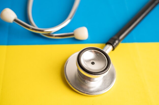 Black stethoscope on ukraine flag background business and finance concept