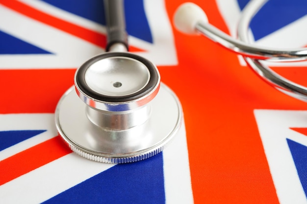 Black stethoscope on United Kingdom flag background Business and finance concept