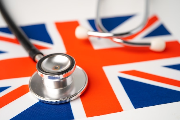 Black stethoscope on United Kingdom flag