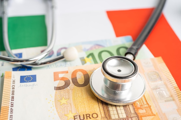 Black stethoscope with Euro banknotes on Italy flag background Business and finance concept