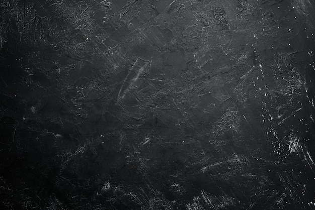 Black stone background Black surface Top view Free space for your text