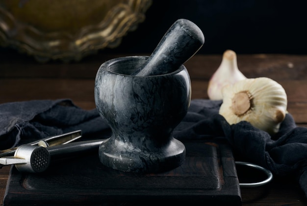 Black stone mortar on a wooden table