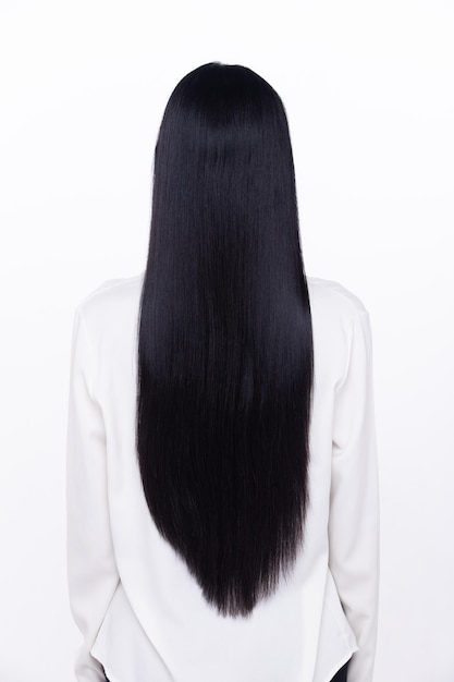 Black Straight Long Black Hair woman has fashion stylish and fun joy to show very long one Female turn back wear white shirt express emotion happy by blow wind hair isolated white background