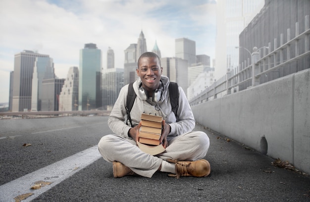 Black student guy with books