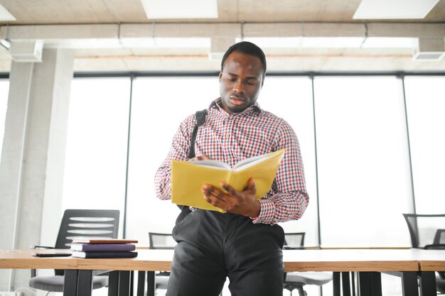 black student at university classroom and thinking of something