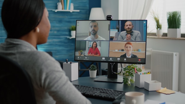 Black student waving high school team explaining marketing
course