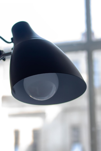 Black Table Lamp on Window Background close up