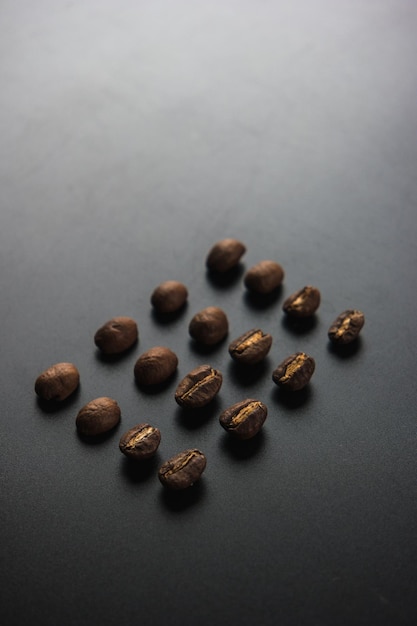 A black table with coffee beans on it