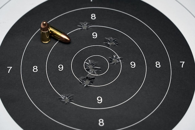 A black target with a black circle that says the number 9 on it.