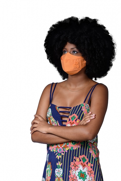 Black teenager wearing protective mask against covid19  isolated on white background