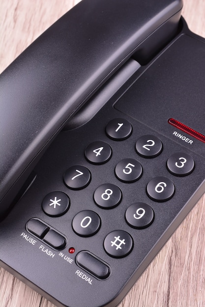 Black Telephone on wooden table