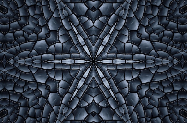 Black texture of burnt wood symmetrical background. Burnt board close-up. Consequences of a fire, the kaleidoscope effect