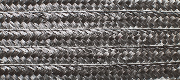 Black textured surface of wicker woven basket banner