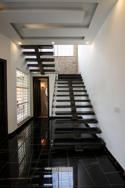 Photo black tile stairs in home