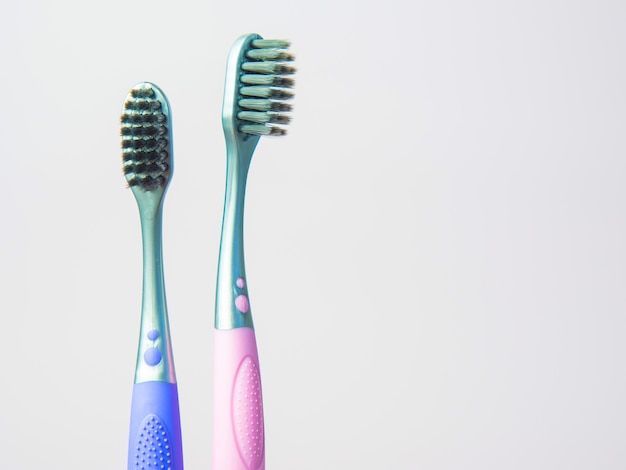 black toothbrush on pastel background closeup