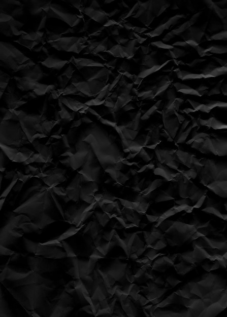 Фото Черный бумажный фон с разорванной текстурой